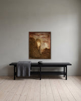 Hidden Shadows by Frantisek Strouhal: a woman's face beside dark shapes, red sky and a glowing mountain peak, the 24 by 30 inch print in a dark oak floater frame, hanging above a black painted bench in a calm room, shown at its true size