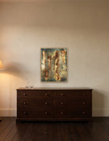 Ascension by Frantisek Strouhal: elongated nude figures floating upward on mottled blue green and ochre, the 24 by 30 inch print in a pale oak floater frame, hanging above a low chest of drawers in a calm room, shown at its true size