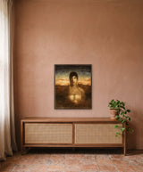 Encounter with the Unknown by Frantisek Strouhal: a woman with long gold earrings against an orange sunset, the 24 by 30 inch print in a dark oak floater frame, hanging above a walnut cabinet in a calm room, shown at its true size