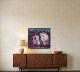 Embracing the Unconscious by Frantisek Strouhal: two faces meeting in profile, plum and teal washes, the 28 by 28 inch print in a black painted floater frame, hanging above a walnut sideboard in a calm room, shown at its true size