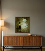 Midnight Request by Frantisek Strouhal: a dark-haired woman raises one hand toward a pale moon in a dark sky, the 28 by 28 inch print in a dark oak floater frame, hanging above a teak credenza in a calm room, shown at its true size
