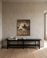 Bathing in the Light by Frantisek Strouhal: a ruined tower by water, small figures in a boat, rust tones, the 24 by 30 inch print in a dark oak floater frame, hanging above a black painted bench in a calm room, shown at its true size