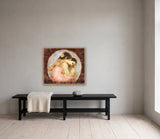 The Flaming Revelation by Frantisek Strouhal: two figures embracing inside a blue circle on deep red-brown, the 30 by 24 inch print in a pale oak floater frame, hanging above a black painted bench in a calm room, shown at its true size