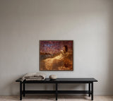 Just a Dream by Frantisek Strouhal: woman in a pale gown reclining by water, violet sky, vase of flowers, the 28 by 28 inch print in a dark oak floater frame, hanging above a black painted bench in a calm room, shown at its true size