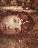A close view of the lower right of the same print, where the separate marks of the inks and the weave of the canvas can be seen.