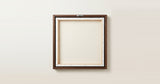 The back of the framed canvas: the canvas stretched over light wooden bars and stapled around the inner edge, one sawtooth hanger fitted to the top bar, and no bracing across the middle. The frame edge is dark oak.