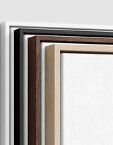 The four frames it comes in, nested one inside another so the wood and the profile of each can be seen: white on the outside, then black, then dark oak, then oak. Each holds a blank canvas, with the shadow gap that runs between the canvas and the wood.
