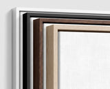 The four frames it comes in, nested one inside another so the wood and the profile of each can be seen: white on the outside, then black, then dark oak, then oak. Each holds a blank canvas, with the shadow gap that runs between the canvas and the wood.