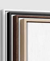 The four frames it comes in, nested one inside another so the wood and the profile of each can be seen: white on the outside, then black, then dark oak, then oak. Each holds a blank canvas, with the shadow gap that runs between the canvas and the wood.