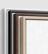 The four frames it comes in, nested one inside another so the wood and the profile of each can be seen: white on the outside, then black, then dark oak, then oak. Each holds a blank canvas, with the shadow gap that runs between the canvas and the wood.