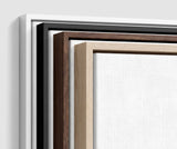 The four frames it comes in, nested one inside another so the wood and the profile of each can be seen: white on the outside, then black, then dark oak, then oak. Each holds a blank canvas, with the shadow gap that runs between the canvas and the wood.