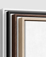 The four frames it comes in, nested one inside another so the wood and the profile of each can be seen: white on the outside, then black, then dark oak, then oak. Each holds a blank canvas, with the shadow gap that runs between the canvas and the wood.