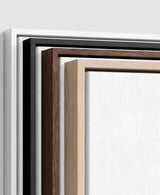 The four frames it comes in, nested one inside another so the wood and the profile of each can be seen: white on the outside, then black, then dark oak, then oak. Each holds a blank canvas, with the shadow gap that runs between the canvas and the wood.
