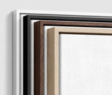 The four frames it comes in, nested one inside another so the wood and the profile of each can be seen: white on the outside, then black, then dark oak, then oak. Each holds a blank canvas, with the shadow gap that runs between the canvas and the wood.
