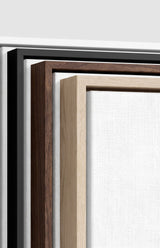 The four frames it comes in, nested one inside another so the wood and the profile of each can be seen: white on the outside, then black, then dark oak, then oak. Each holds a blank canvas, with the shadow gap that runs between the canvas and the wood.